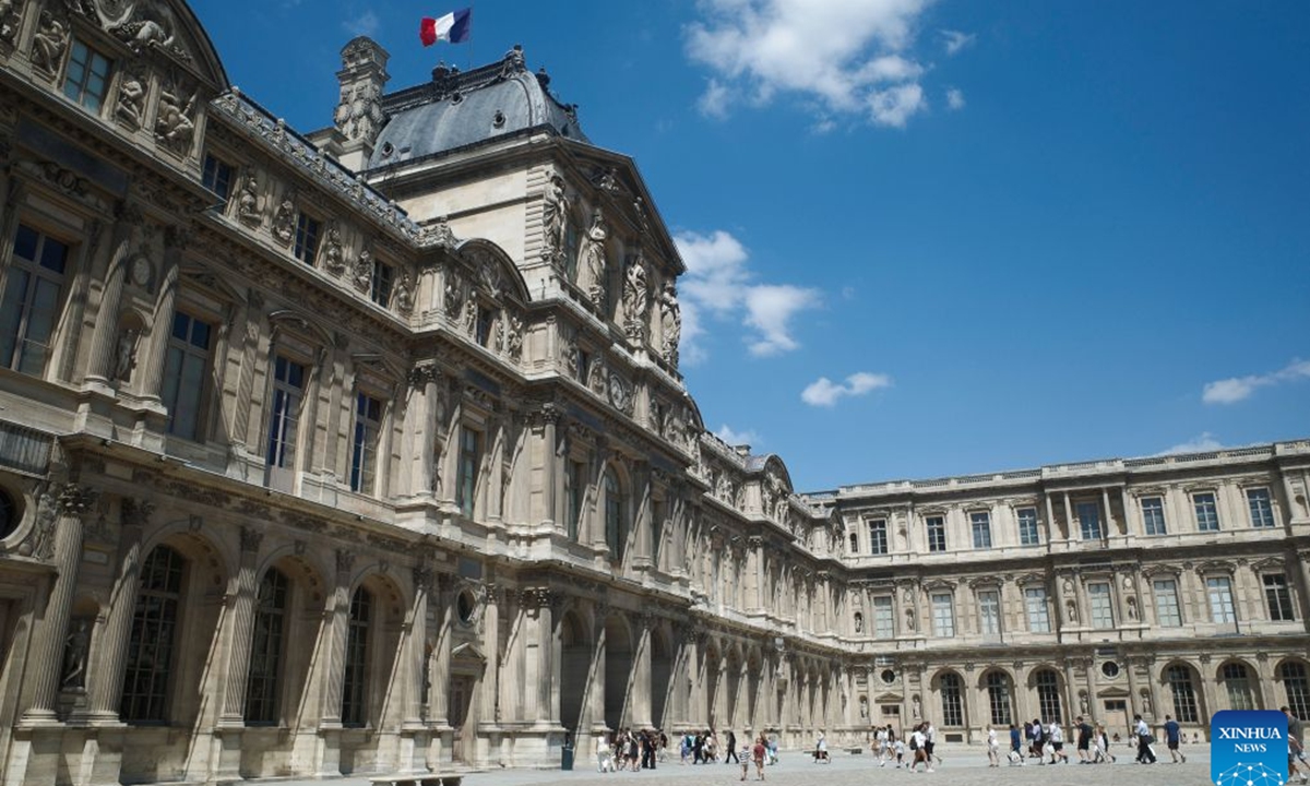 Tourists are pictured near the Louvre Museum in Paris, France, July 21, 2026. The Apollo Gallery at the Louvre Museum, which was robbed in October 2025, is set to reopen to the public on Wednesday, with no jewelry to be displayed, French media reported on Monday. (Xinhua/Wu Huiwo)