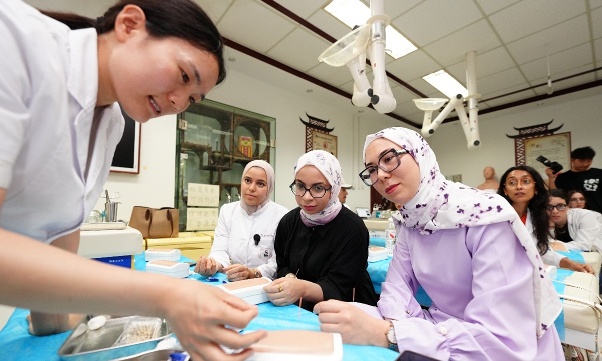 International students from Tunisia learn traditional Chinese medicine techniques under the guidance of an instructor in Tianjin Municipality, North China, on July 14, 2026. Photo: VCG
