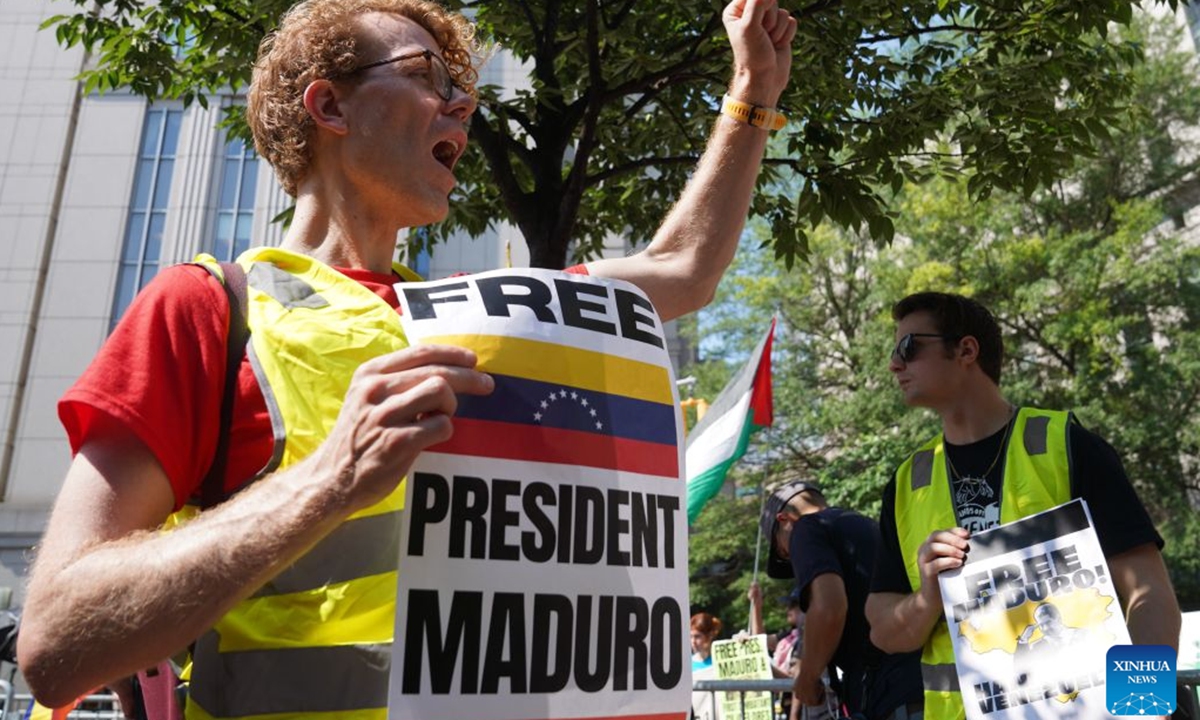 Supporters of Venezuelan President Nicolas Maduro protest outside a courthouse in New York, the United States, July 22, 2026. Venezuelan President Nicolas Maduro and his wife Cilia Flores will go on trial starting on June 1, 2027, a U.S. judge ruled on Wednesday. The couple, who pleaded not guilty to drug trafficking and firearms charges, made their third appearance in a New York court after the forcible seizure by U.S. troops in a military raid in early January. (Xinhua/Zhang Fengguo)