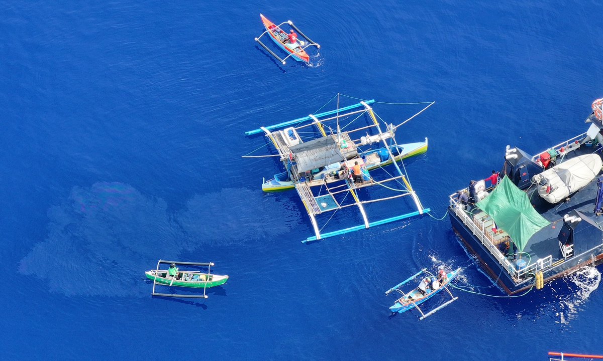 Drone image shows Philippine public vessels in waters near China's Huangyan Dao on July 23, 2026, for a supply mission for 12 Philippine 