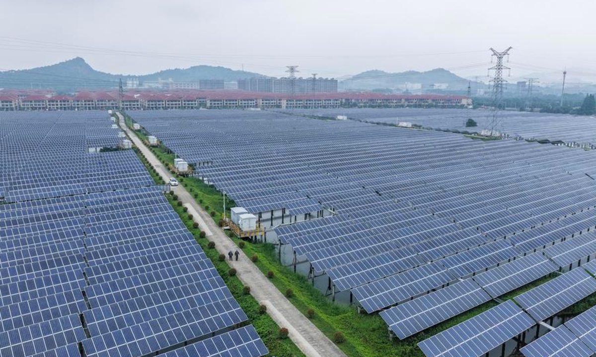 A drone photo shows staff members of State Grid Huzhou power supply company conducting inspection on the photovoltaic lines and equipment at a photovoltaic power station in Changxing County of Huzhou City, east China's Zhejiang Province, May 27, 2026. (Xinhua/Xu Yu)
