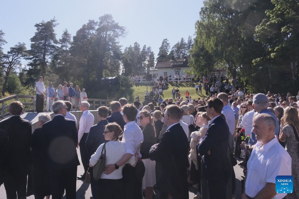 People attend a name-reading and wreath-laying ceremony on Utoya Island, Norway, July 22, 2026. Norwegian Prime Minister Jonas Gahr Store on Wednesday warned of the growing threat of far-right radicalization among young people, saying social media, artificial intelligence and social isolation were fueling extremism, as the country marked the 15th anniversary of the July 22, 2011 terror attacks. (Xinhua/Zhang Yuliang)