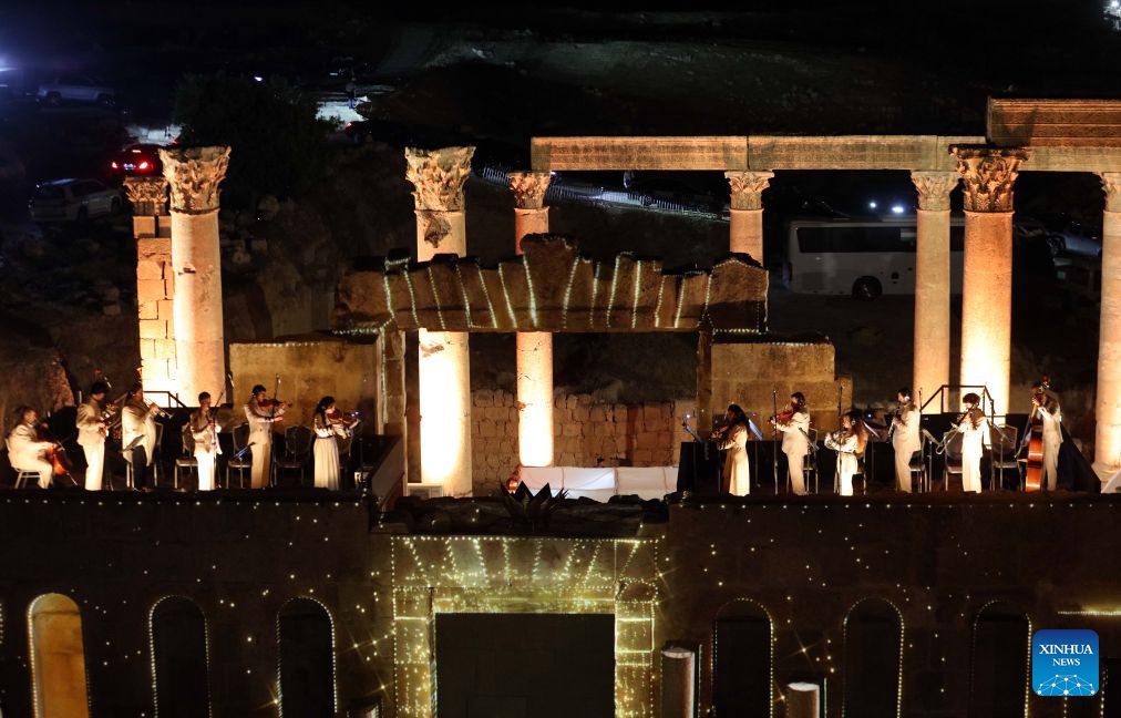 Artists perform at a theater of Jerash archaeological site during the 40th Jerash Festival for Culture and Arts in Jerash, Jordan, July 22, 2026. Jordan's Jerash Festival for Culture and Arts will mark its 40th edition from July 22 to Aug. 2, turning the ancient Roman city of Jerash into a vibrant hub for cultural exchange, artistic expression and civilizational dialogue. (Photo by Mohammad Abu Ghosh/Xinhua)