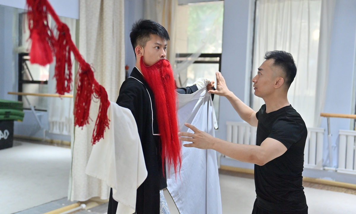 A student practices Peking Opera skills under the guidance of a professional instructor in Changchun, Northeast China's Jilin Province, on July 23, 2026. Peking Opera, hailed as the quintessence of Chinese culture, is a comprehensive traditional performing art that integrates four core skills: singing, recitation, acting and acrobatic fighting. Photo: VCG