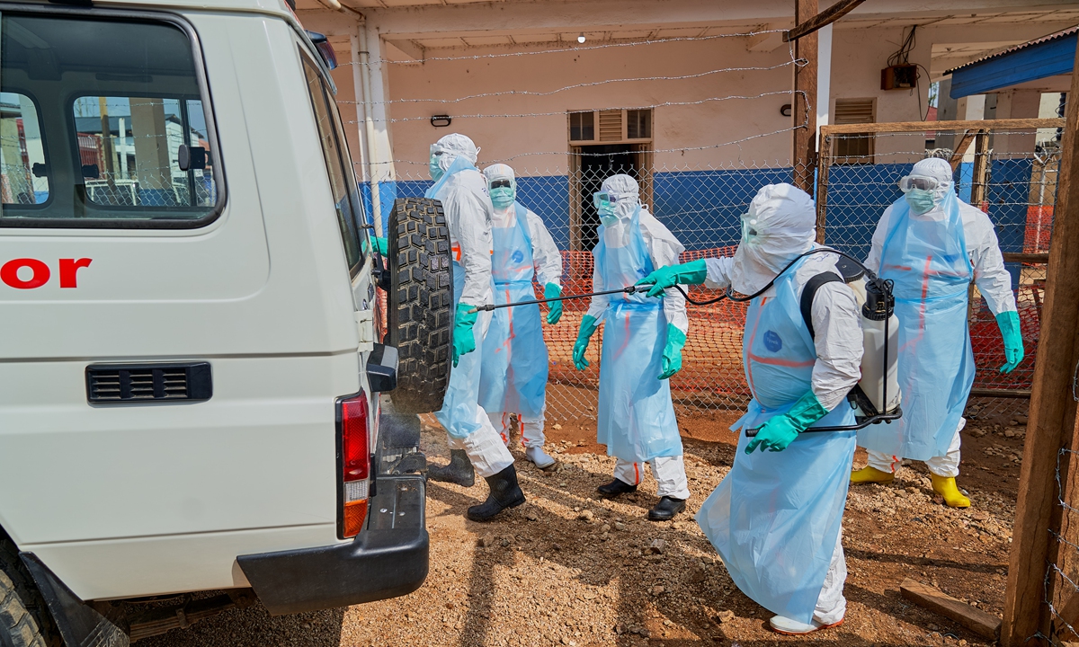 A staff member disinfects a hearse at the Ebola treatment center of the General Hospital in Bunia, Ituri province, Democratic Republic of Congo, on July 22, 2026 local time. More than 1,000 people have died in the Ebola outbreak in Congo, according to Africa's top health body, a grim toll in the fastest Ebola outbreak in history, AP reported. Photo: IC