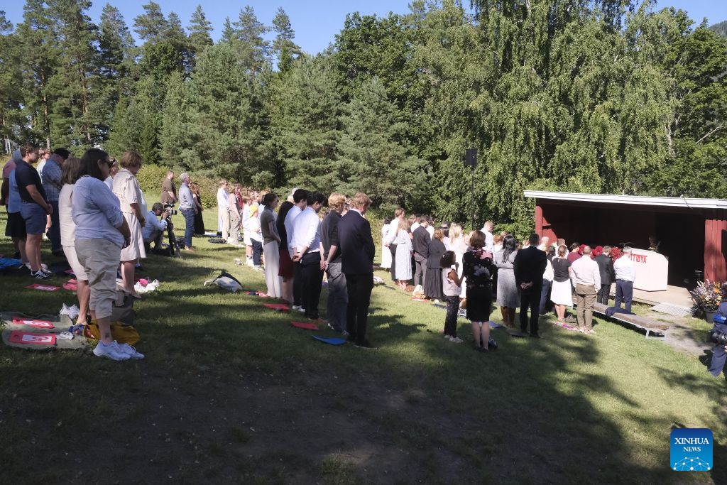 People observe a moment of silence during a memorial event marking the 15th anniversary of the July 22, 2011 terror attacks on Utoya Island, Norway, July 22, 2026. Norwegian Prime Minister Jonas Gahr Store on Wednesday warned of the growing threat of far-right radicalization among young people, saying social media, artificial intelligence and social isolation were fueling extremism, as the country marked the 15th anniversary of the July 22, 2011 terror attacks. (Xinhua/Zhang Yuliang)