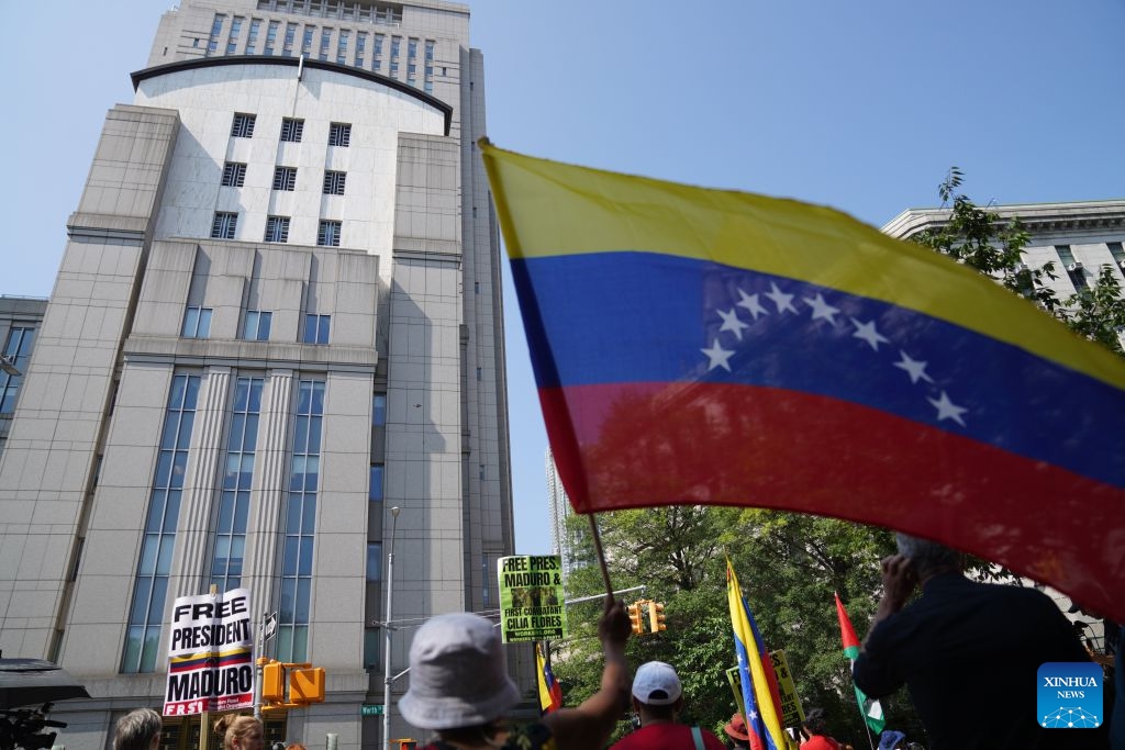 Supporters of Venezuelan President Nicolas Maduro protest outside a courthouse in New York, the United States, July 22, 2026. Venezuelan President Nicolas Maduro and his wife Cilia Flores will go on trial starting on June 1, 2027, a U.S. judge ruled on Wednesday.

The couple, who pleaded not guilty to drug trafficking and firearms charges, made their third appearance in a New York court after the forcible seizure by U.S. troops in a military raid in early January. (Xinhua/Zhang Fengguo)