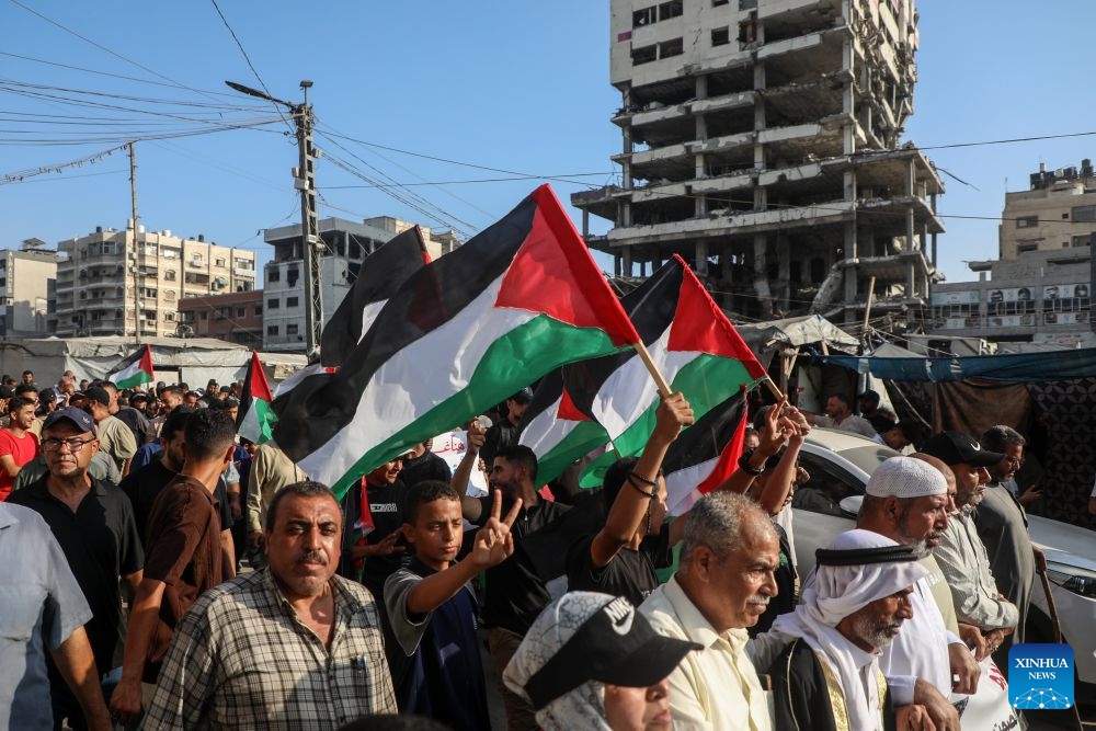 Palestinians take part in a march to protest against Israeli plans for forced displacement in Gaza City, July 23, 2026. (Photo by Rizek Abdeljawad/Xinhua)