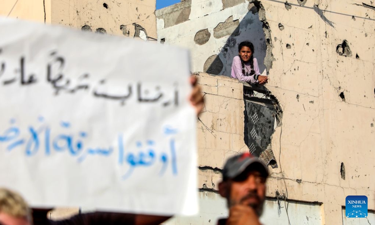 Palestinians take part in a march to protest against Israeli plans for forced displacement in Gaza City, July 23, 2026. (Photo by Rizek Abdeljawad/Xinhua)