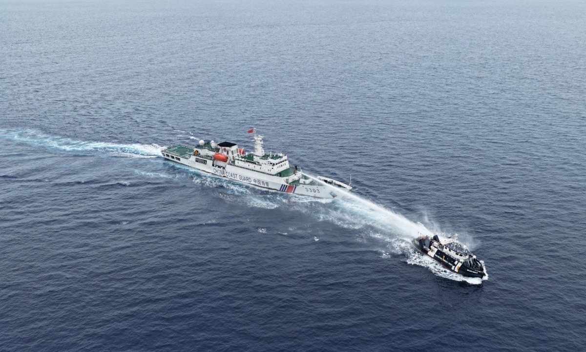 China Coast Guard vessel 3303 deploys water cannons on July 24, 2026, against Philippine public vessel MMOV 3001, which had intruded into China's Huangyan Dao waters, forcing the vessel to turn around and sail away from Huangyan Dao. Photo: Courtesy of China Coast Guard
