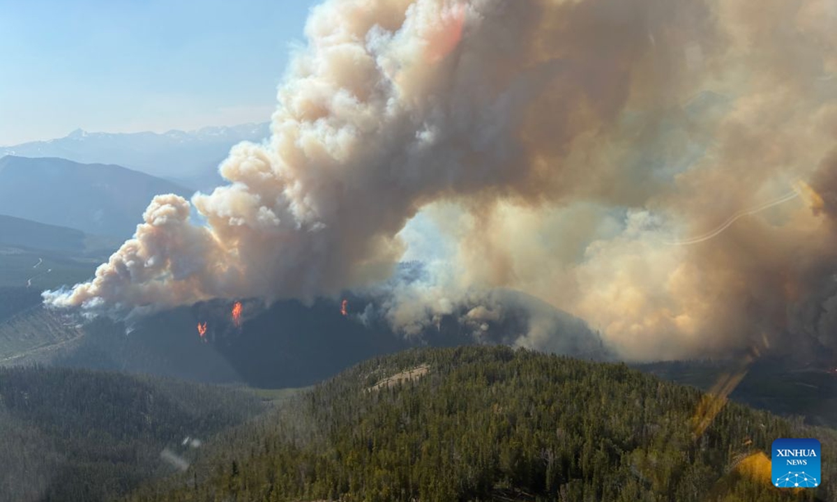 An aerial photo provided by the BC Wildfire Service on July 22, 2026 shows a wildfire near Bonanza Creek in British Columbia, Canada. (BC Wildfire Service/Handout via Xinhua)