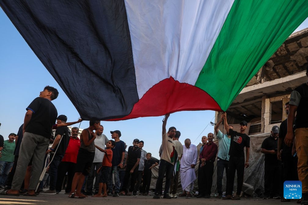 Palestinians take part in a march to protest against Israeli plans for forced displacement in Gaza City, July 23, 2026. (Photo by Rizek Abdeljawad/Xinhua)