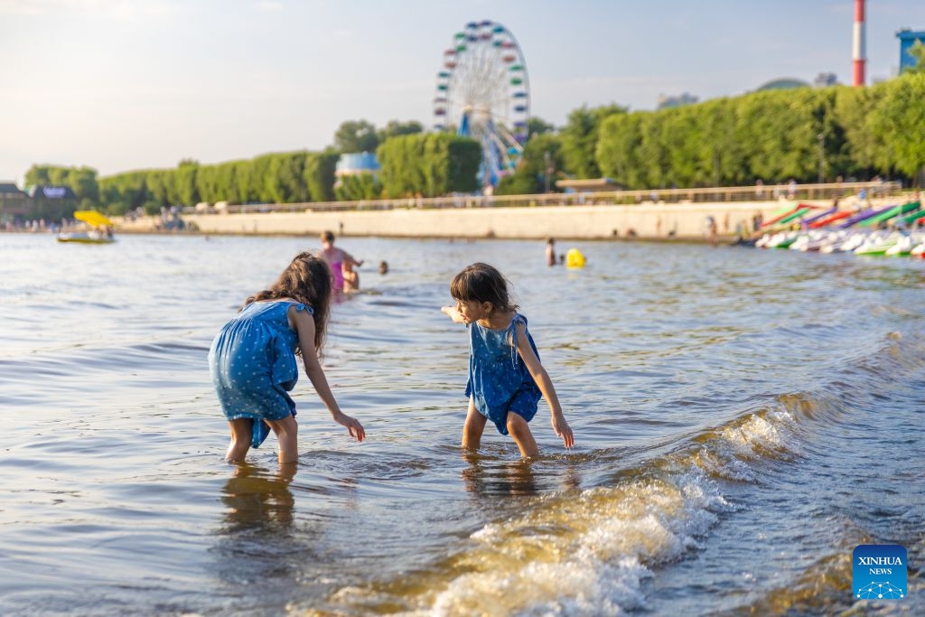 Children play by the seashore in Vladivostok, Russia, July 22, 2026. (Photo by Andrey Matveenko/Xinhua)