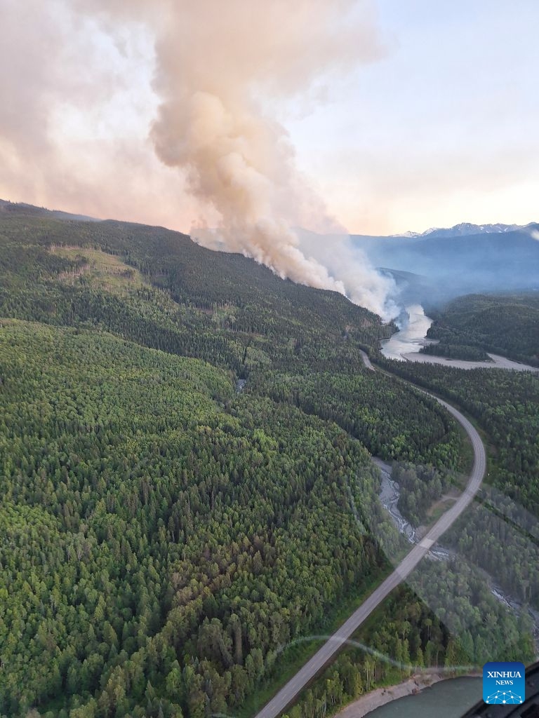 An aerial photo provided by the BC Wildfire Service on July 22, 2026 shows a wildfire near Bonanza Creek in British Columbia, Canada. (BC Wildfire Service/Handout via Xinhua)