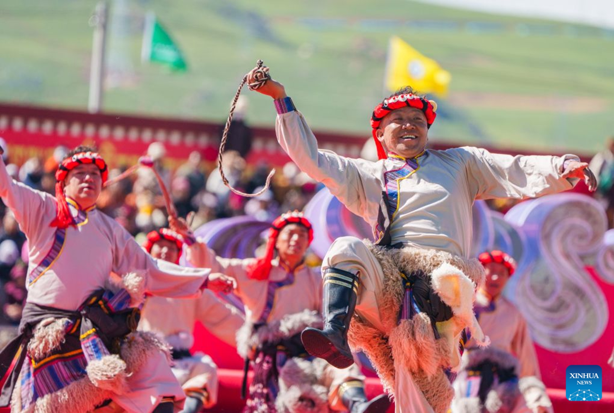 People perform at the opening ceremony of a horse racing competition in Amdo County, southwest China's Xizang Autonomous Region, July 23, 2026. The horse racing competition kicked off here on Thursday, featuring vibrant performances and horse racing events. (Xinhua/Tenzin Nyida)