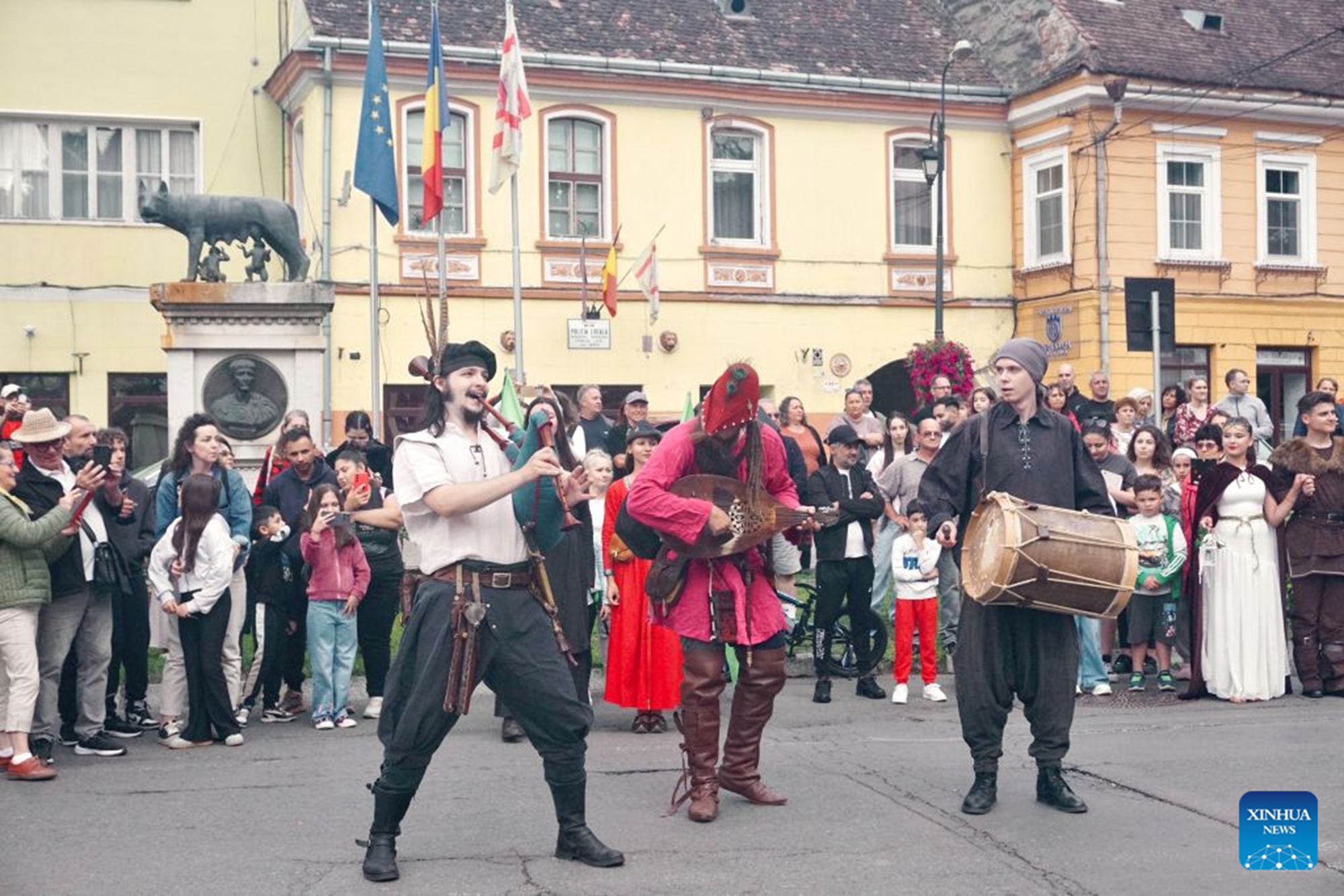 Local residents attend a parade during the Sighisoara Medieval Festival in Sighisoara, Romania, July 24, 2026. The annual Sighisoara Medieval Festival kicked off here on Friday and will last until Sunday. First launched in 1992, the festival is now a distinctive historical celebration in Europe, which revives medieval culture and traditions through various activities. The historic center of Sighisoara was inscribed as a UNESCO World Heritage in 1999. (Xinhua/Yao Yulin)