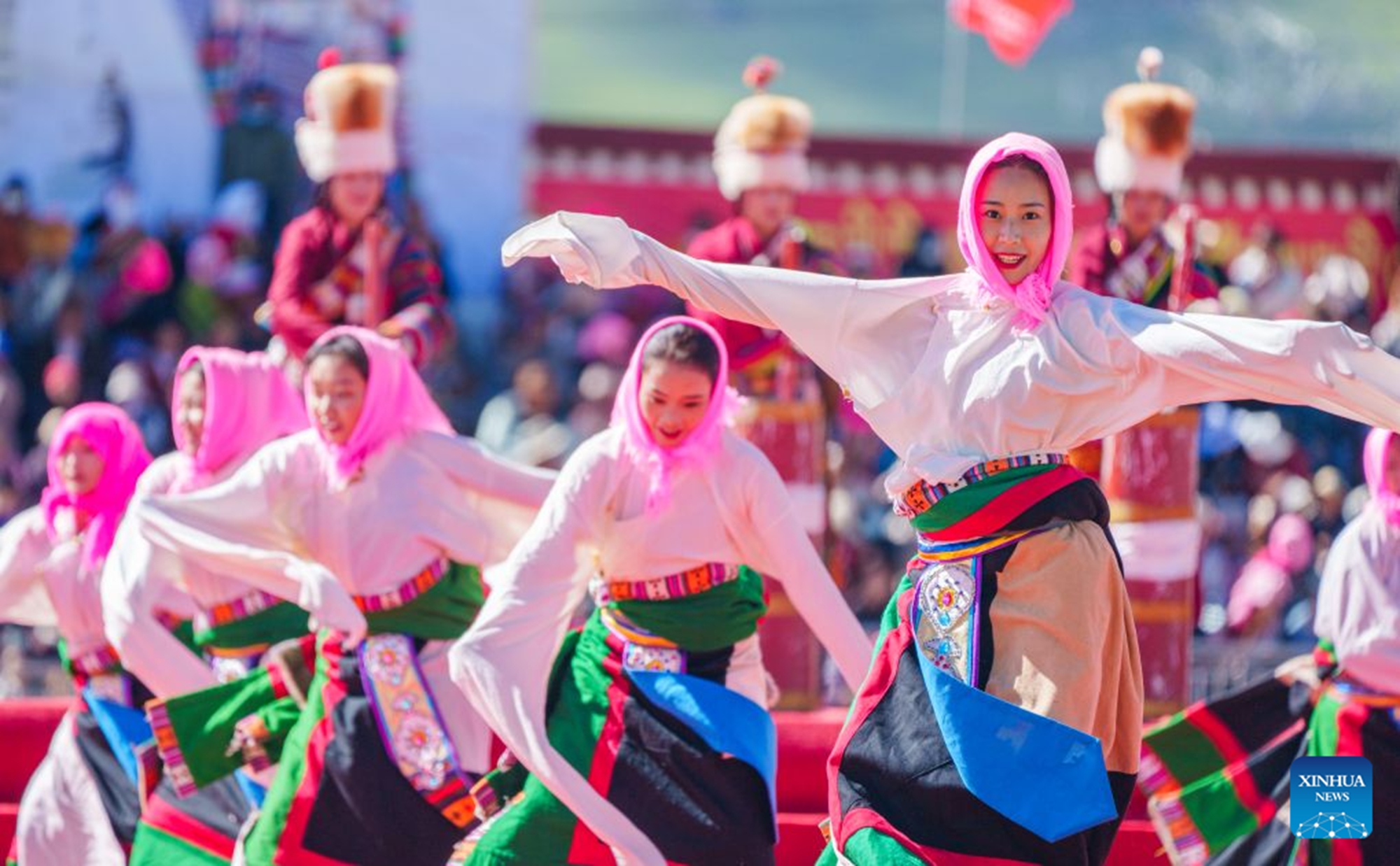 People perform at the opening ceremony of a horse racing competition in Amdo County, southwest China's Xizang Autonomous Region, July 23, 2026. The horse racing competition kicked off here on Thursday, featuring vibrant performances and horse racing events. (Xinhua/Tenzin Nyida)