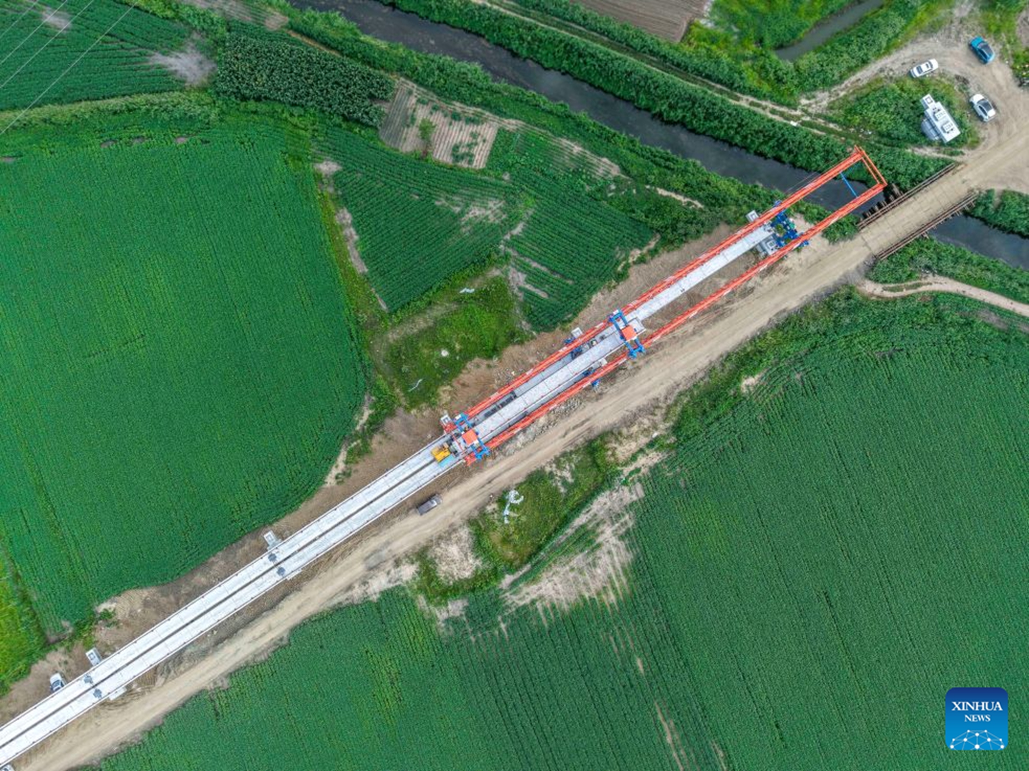 An aerial drone photo taken on July 25, 2026 shows the construction site of the Tongjiang super major bridge in northeast China's Heilongjiang Province.(Xinhua/Wang Song)