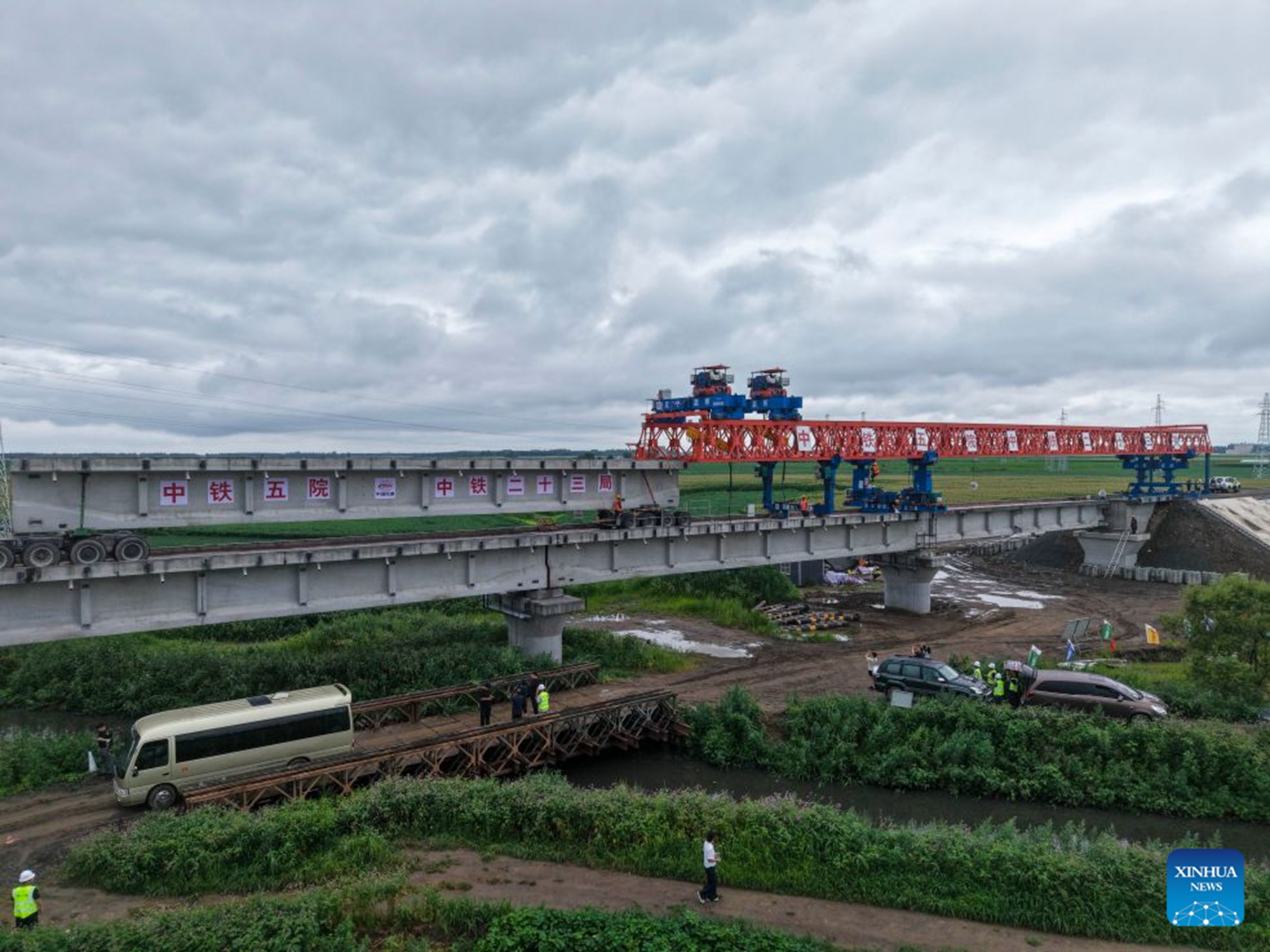An aerial drone photo taken on July 25, 2026 shows the construction site of the Tongjiang super major bridge in northeast China's Heilongjiang Province.(Xinhua/Wang Song)