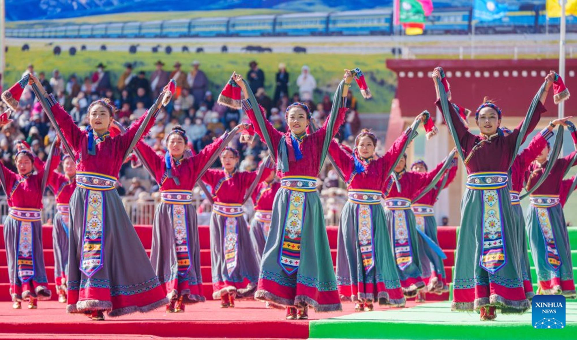 People perform at the opening ceremony of a horse racing competition in Amdo County, southwest China's Xizang Autonomous Region, July 23, 2026. The horse racing competition kicked off here on Thursday, featuring vibrant performances and horse racing events. (Xinhua/Tenzin Nyida)