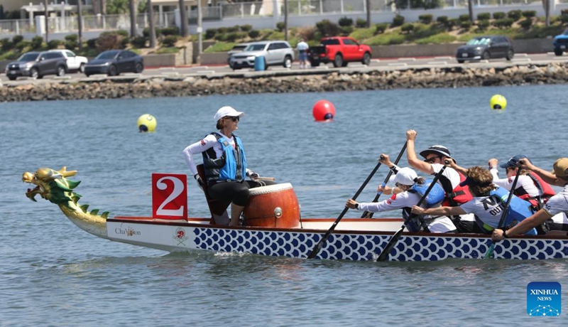 People compete during the Long Beach Dragon Boat Festival in Long Beach, California, the United States, July 25, 2026. (Photo by Zeng Hui/Xinhua)