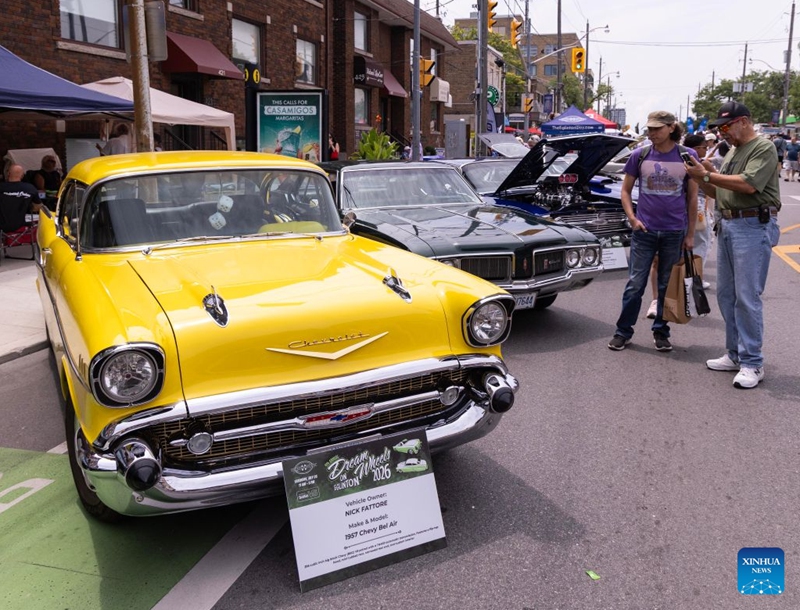 People view vintage cars on display at the Dream Wheels on Eglinton 2026 in Toronto, Canada, July 25, 2026. The event was held here on Saturday featuring a curated showcase of classic cars. (Photo by Zou Zheng/Xinhua)