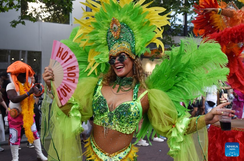 A dancer performs during the Rotterdam Summer Carnival, which was inscribed on UNESCO's Intangible Cultural Heritage, in Rotterdam, the Netherlands, July 25, 2026. (Xinhua/Shao Haijun)
