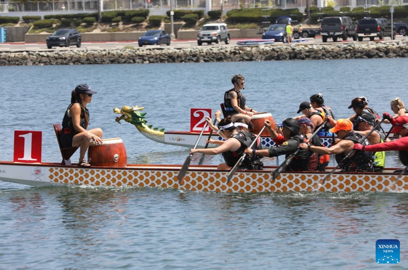 People compete during the Long Beach Dragon Boat Festival in Long Beach, California, the United States, July 25, 2026. (Photo by Zeng Hui/Xinhua)