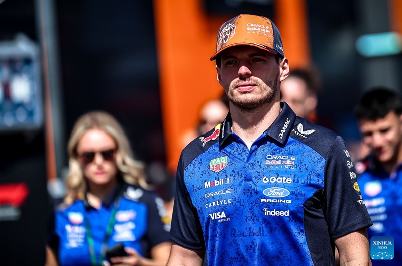 Red Bull's Dutch driver Max Verstappen arrives at the paddock before the third free practice session of the Formula One Hungarian Grand Prix at the Hungaroring in Mogyorod, near Budapest, Hungary, July 25, 2026. (Photo by David Balogh/Xinhua)
