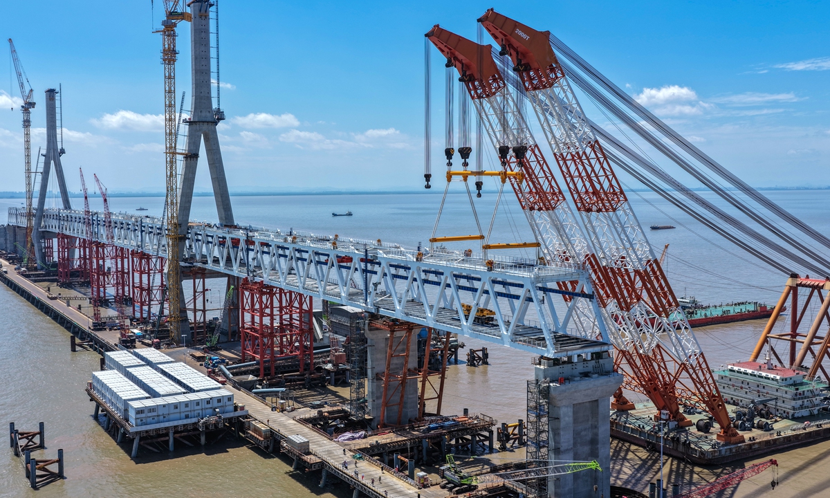 All steel truss girders are installed on the south navigable span of the Hangzhou Bay cross-sea railway bridge in Jiaxing, East China's Zhejiang Province, on July 26, 2026. The bridge, which is part of the Nantong to Ningbo high-speed railway, marks the first of its three navigable spans to complete the erection of girders. Photo: VCG