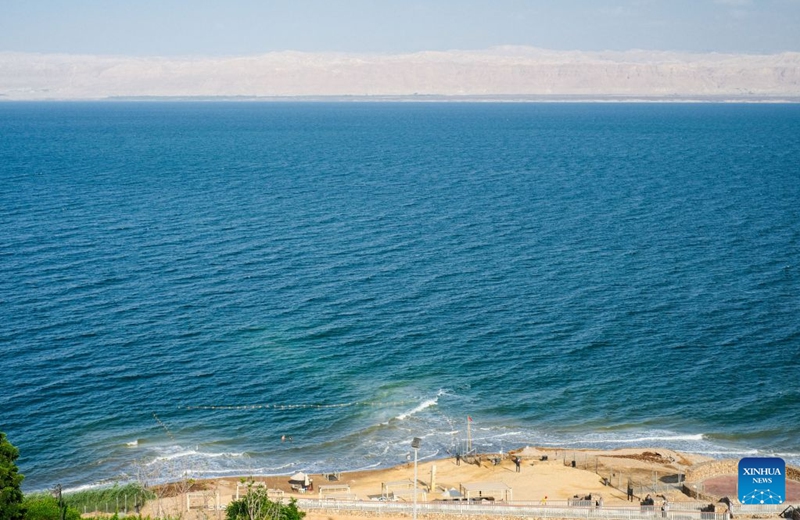This photo taken on July 25, 2026 shows a view of the Dead Sea in Jordan. The Dead Sea has been experiencing a long-term decline in its water level due to reduced inflow from the Jordan River, the region's naturally high evaporation rates, and industrial mineral extraction. Available data show that as of July 2026, the Dead Sea's surface was approximately 440 meters below sea level, and its water level has been declining by an average of more than one meter annually. (Xinhua/Xin Mengchen)