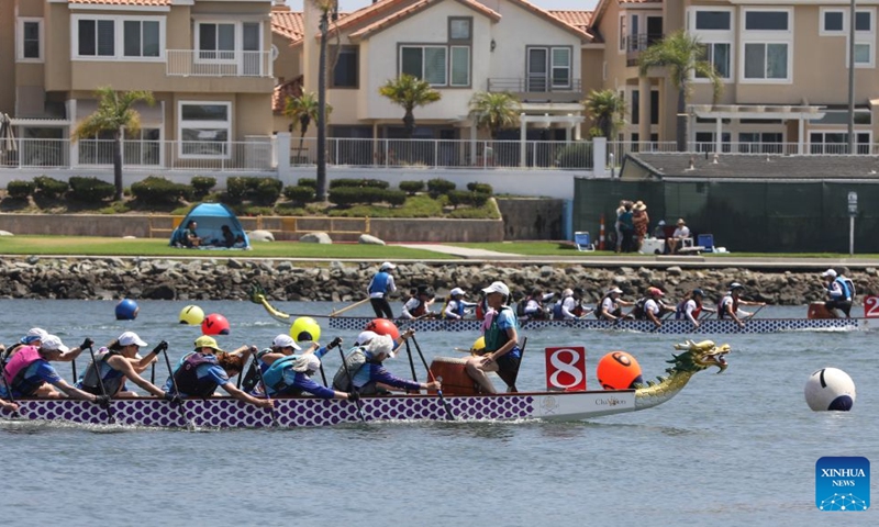 People compete during the Long Beach Dragon Boat Festival in Long Beach, California, the United States, July 25, 2026. (Photo by Zeng Hui/Xinhua)