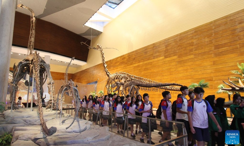 Students view dinosaur fossils at the Tahir Solo Museum in Surakarta, Indonesia, July 25, 2026. (Photo by Bram Selo/Xinhua)