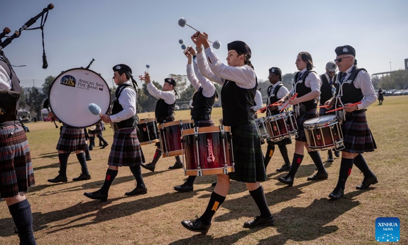 Members of a pipe band perform during the SA Pipe Band Championships in Bedfordview, South Africa, July 25, 2026. (Photo by Ihsaan Haffejee/Xinhua)