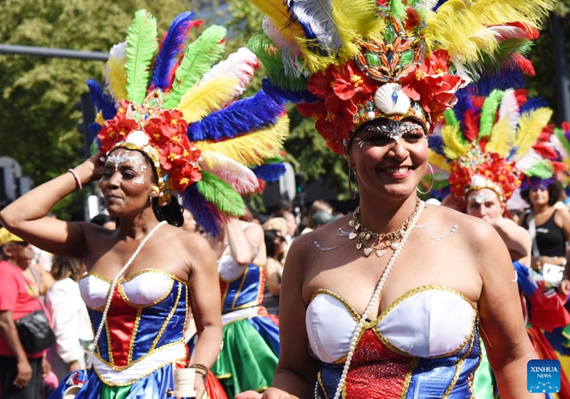Dancers perform during the Rotterdam Summer Carnival, which was inscribed on UNESCO's Intangible Cultural Heritage, in Rotterdam, the Netherlands, July 25, 2026. (Xinhua/Shao Haijun)