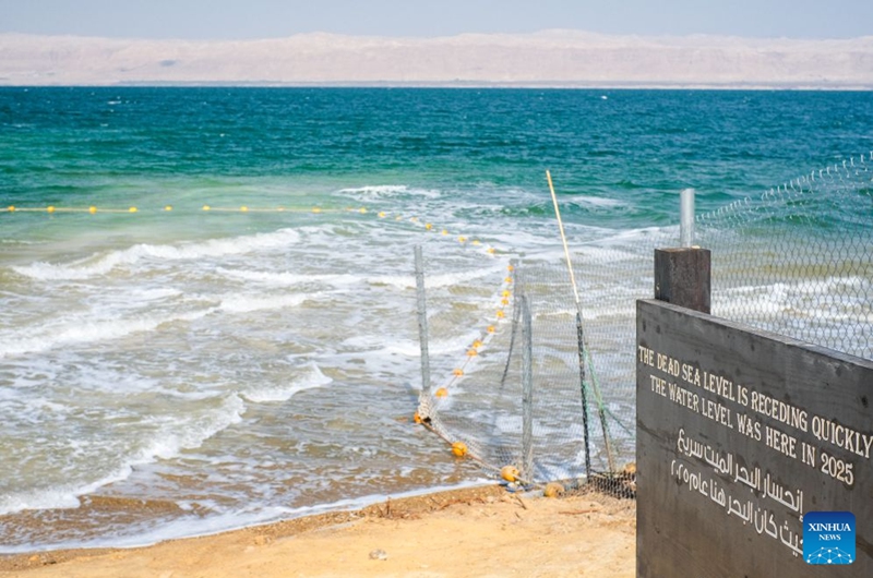 This photo taken on July 25, 2026 shows a sign marking the former water level near the Dead Sea in Jordan. The Dead Sea has been experiencing a long-term decline in its water level due to reduced inflow from the Jordan River, the region's naturally high evaporation rates, and industrial mineral extraction. Available data show that as of July 2026, the Dead Sea's surface was approximately 440 meters below sea level, and its water level has been declining by an average of more than one meter annually. (Xinhua/Xin Mengchen)