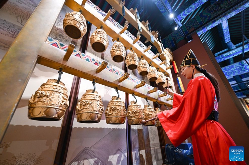 A staff member plays bianzhong, or chime bells, at the Divine Music Administration inside the Temple of Heaven Park in Beijing, capital of China, July 24, 2026. The renovated Divine Music Administration has opened to the public since February in 2026, it also serves as a main exhibition area of the museum of the Temple of Heaven since June this year. Marking the second anniversary of the successful inscription of the Beijing Central Axis on the UNESCO World Heritage List, heritage sites along the Beijing Central Axis, such as the Palace Museum, Zhengyangmen Gate, and Altar of the God of Agriculture, also referred to as the Xiannongtan Temple, will either open to the public free of charge or launch new exhibitions on July 27.
Over the past two years, efforts to conserve, inherit and make good use of the Beijing Central Axis have advanced steadily, achieving new outcomes in areas including related legal system, UNESCO World Heritage signage, landscape improvement, creative utilization, collaborative protection and international communication. Photo: Xinhua