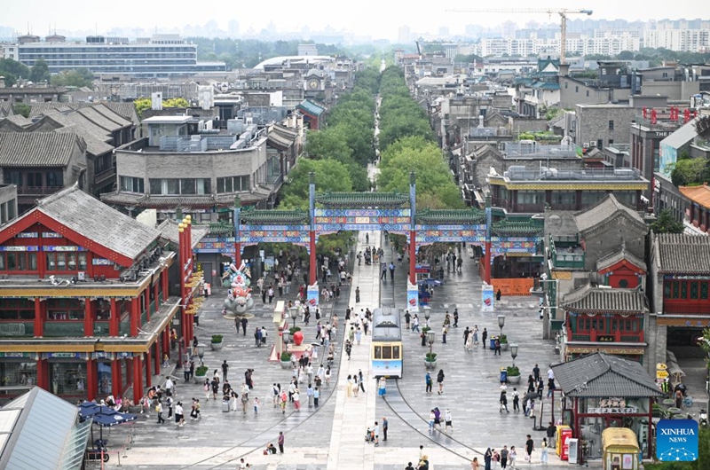 This photo taken on July 24, 2026 shows a view of the Qianmen pedestrian street in Beijing, capital of China. Marking the second anniversary of the successful inscription of the Beijing Central Axis on the UNESCO World Heritage List, heritage sites along the Beijing Central Axis, such as the Palace Museum, Zhengyangmen Gate, and Altar of the God of Agriculture, also referred to as the Xiannongtan Temple, will either open to the public free of charge or launch new exhibitions on July 27.
Over the past two years, efforts to conserve, inherit and make good use of the Beijing Central Axis have advanced steadily, achieving new outcomes in areas including related legal system, UNESCO World Heritage signage, landscape improvement, creative utilization, collaborative protection and international communication. Photo: Xinhua
