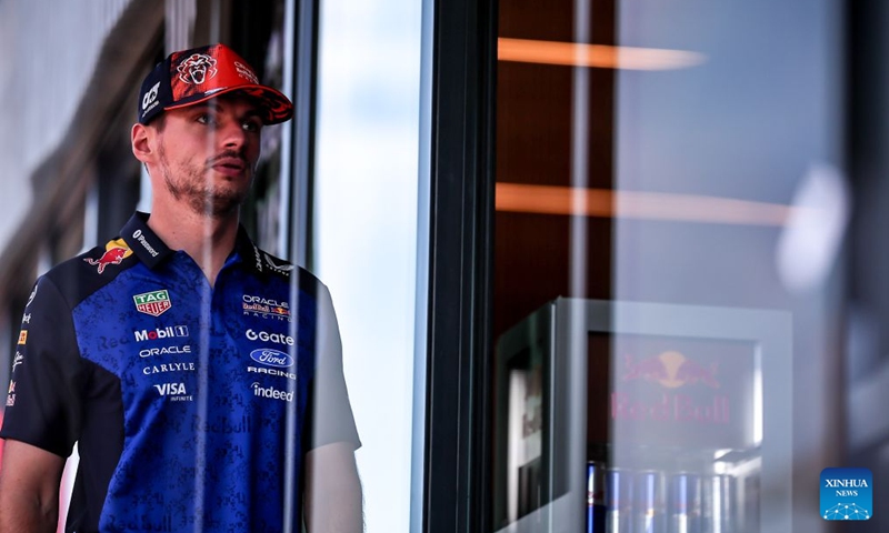 Red Bull's Dutch driver Max Verstappen arrives at the paddock before the third free practice session of the Formula One Hungarian Grand Prix at the Hungaroring in Mogyorod, near Budapest, Hungary, July 25, 2026. (Photo by David Balogh/Xinhua)