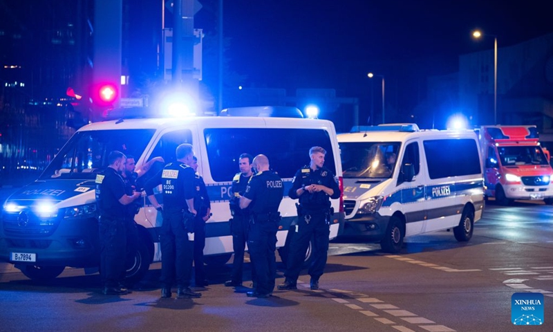 Rescue vehicles are pictured near the site where a car drove into a crowd in Berlin, Germany, July 26, 2026. One person was killed and 16 others were injured, including several with life-threatening injuries, after a car drove into a crowd at a large Pride celebration in central Berlin on Saturday evening, a police spokesperson said. (Xinhua/Zhang Haofu)