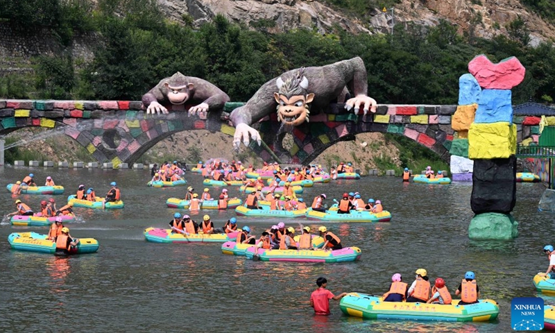 Tourists enjoy rafting at the grand canyon rafting scenic area in Pingshan County of Shijiazhuang, north China's Hebei Province, July 26, 2026. Shijiazhuang City has leveraged the high-quality mountain and water resources of the Taihang Mountains to develop distinctive cultural tourism experience programs in recent years, attracting a large influx of tourists for summer retreats. (Photo by Chen Qibao/Xinhua)