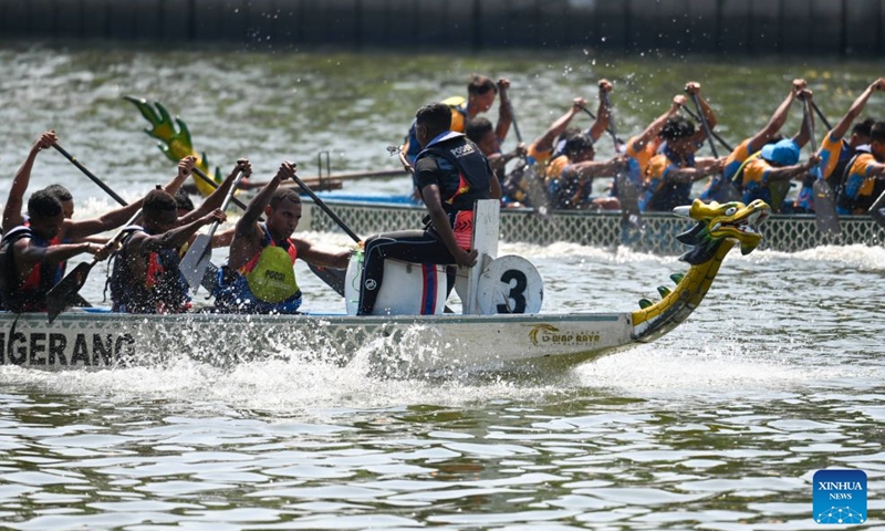 Teams compete in a dragon boat race during the Cisadane Festival in Tangerang, Banten Province, Indonesia, July 26, 2026.