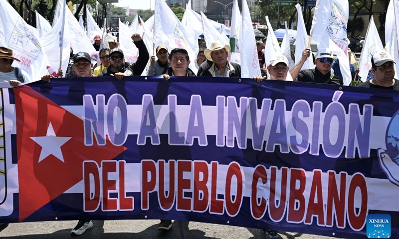 Protesters march during a demonstration in support of Cuba and against U.S. embargo on Cuba, in Mexico City, Mexico on July 26, 2026. The demonstration aimed to commemorate the 73rd anniversary of the assault on Moncada and Carlos Manuel de Cespedes garrisons that took place on July 26, 1953, seen as the beginning of the Cuban Revolution. (Xinhua/Wu Wei)