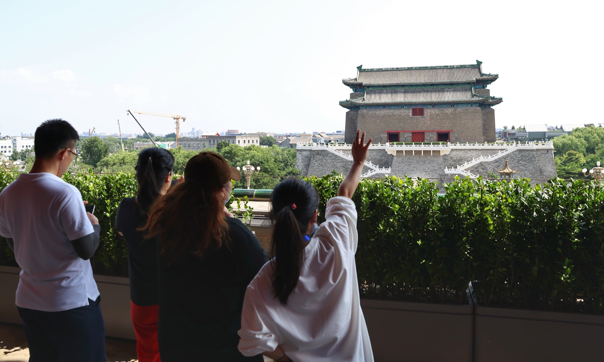 Visitors look at the Zhengyangmen Archery Tower from atop the reopened Zhengyangmen Gate Tower in Beijing on July 27, 2026. Photo: VCG