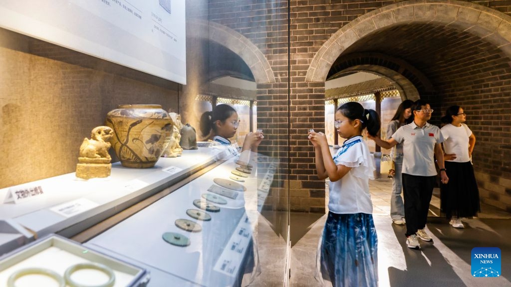People visit Sihong museum in Sihong County, east China's Jiangsu Province, July 26, 2026. Museums have become popular in hot summer in many regions across China, drawing large crowds seeking both knowledge and coolness. (Photo by Xu Changliang/Xinhua)