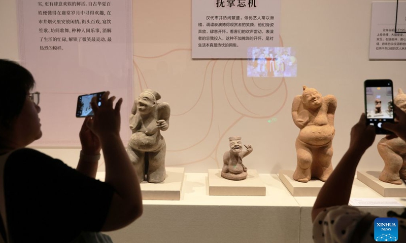 People visit the exhibition Smiles: Imprints of the Chinese Spirit in Cultural Relics at the Liaoning Provincial Museum in Shenyang, northeast China's Liaoning Province, July 26, 2026.