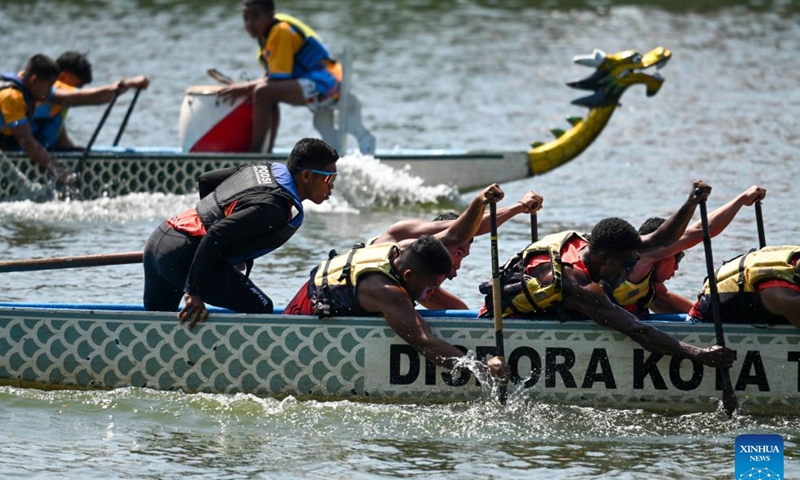 Teams compete in a dragon boat race during the Cisadane Festival in Tangerang, Banten Province, Indonesia, July 26, 2026.