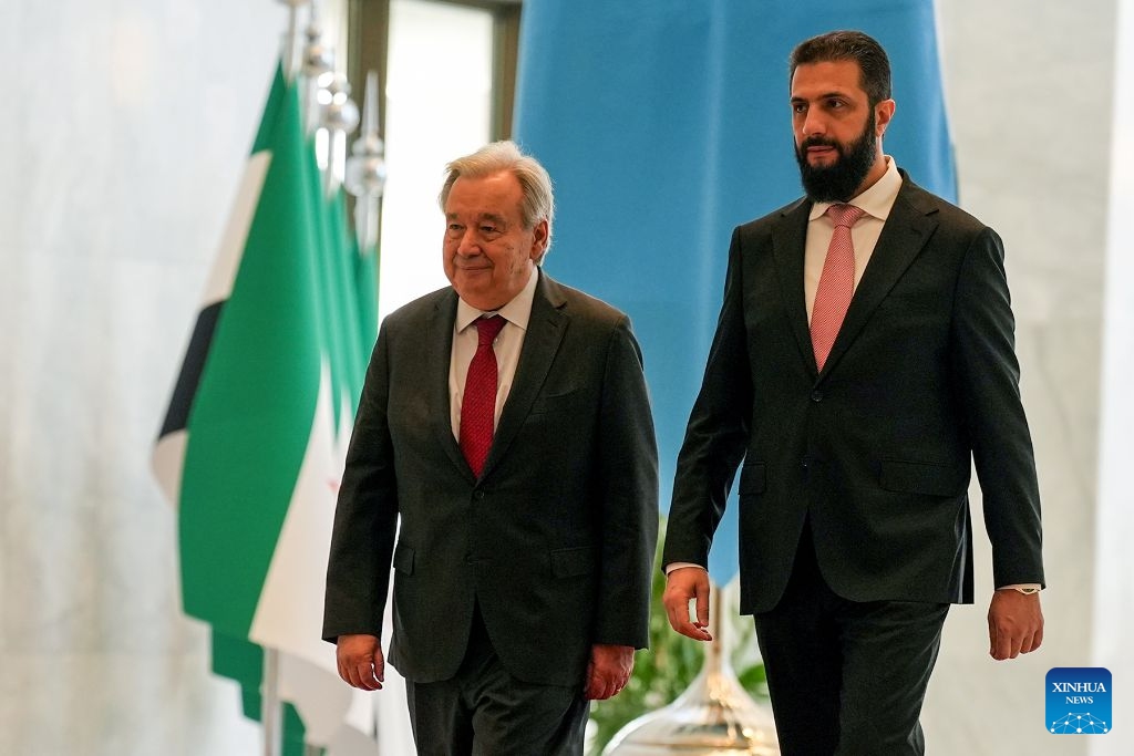 UN Secretary-General Antonio Guterres is welcomed by Syria's interim leader Ahmad al-Sharaa in Damascus, Syria, July 25, 2026. Guterres visited Syria on Saturday, pledging continued UN support for the country's recovery and reconstruction in the first visit by a UN chief to Damascus since 2009. (Xinhua)