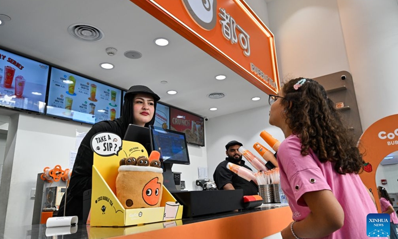 A staff member takes orders at CoCo, a Chinese-brand tea and juice store, in Amman, Jordan, July 21, 2026. As the economic and trade cooperation and cultural exchanges between China and Jordan continue to deepen, a growing number of Chinese elements have found their way into the daily lives of Jordanians. (Xinhua/Xin Mengchen)


