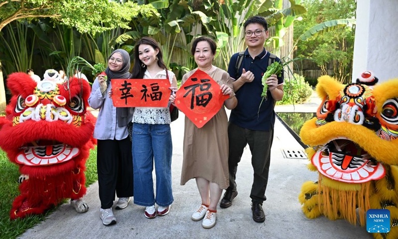 Journalists and social media influencers from ASEAN countries pose for a photo at a hot spring resort in Qingyuan, south China's Guangdong Province, July 27, 2026.

